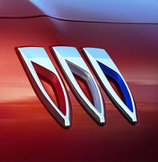 4 Buick Vehicles staged on a mountain road